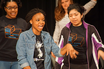Students dancing at social justice theater.