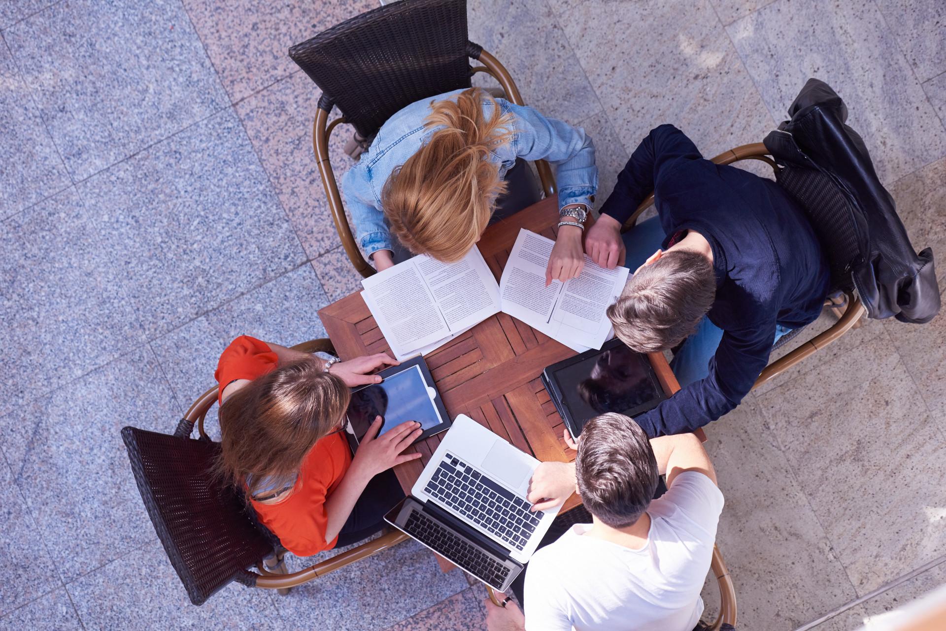 Aerial view of four students studying together